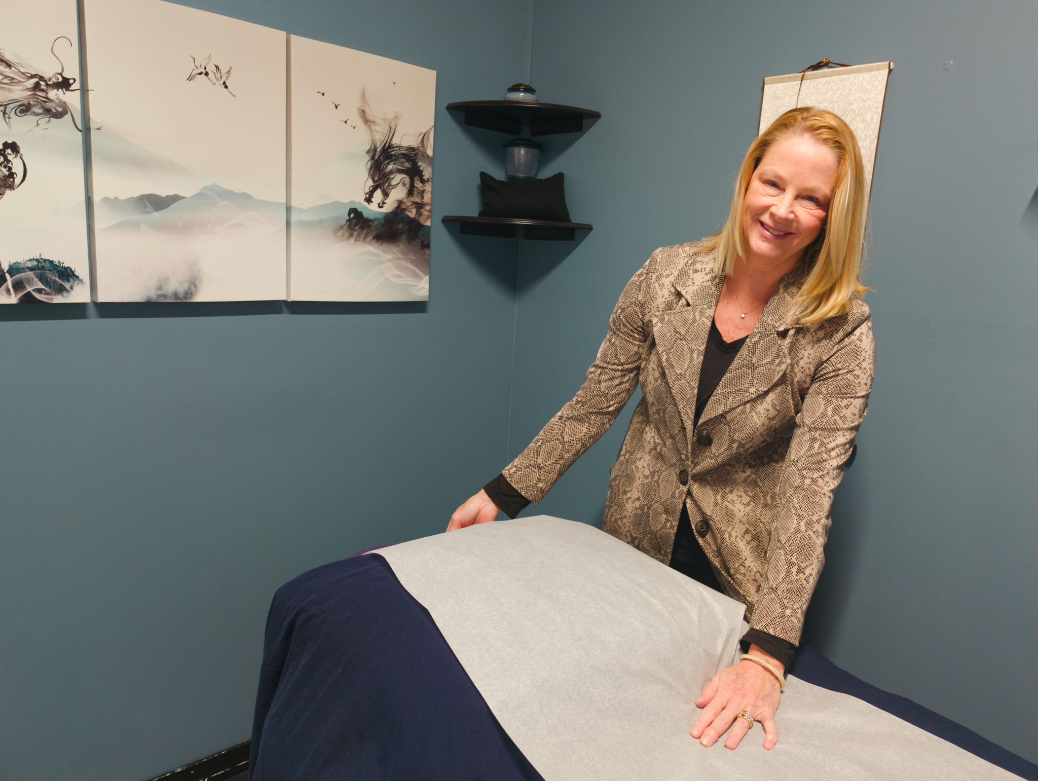Acupuncturist Patty Kuchar, at her location over an empty patient bed.